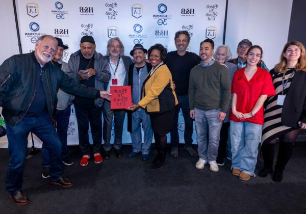 A group photo with the cast of "Blood In Blood Out" and Cal State LA president, Berenecea Eanes.